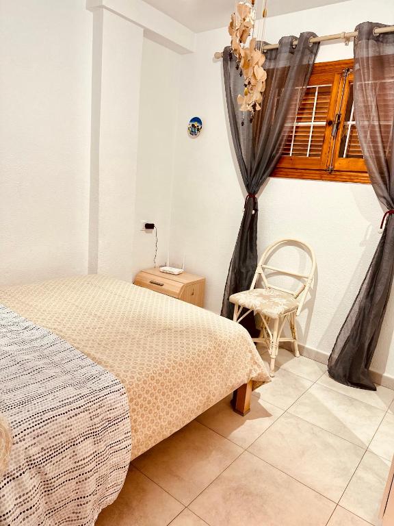 A bed or beds in a room at Apartment Santana -19 at Beach with Pool, Garage and Lift