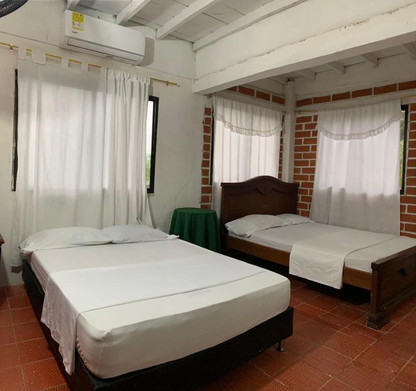 Postel nebo postele na pokoji v ubytování CABAÑA VILLA DEL COCO