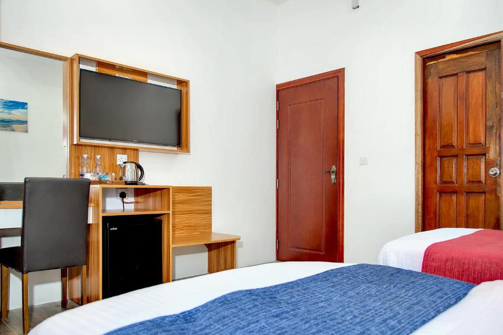 Postel nebo postele na pokoji v ubytování Manta Sky Inn