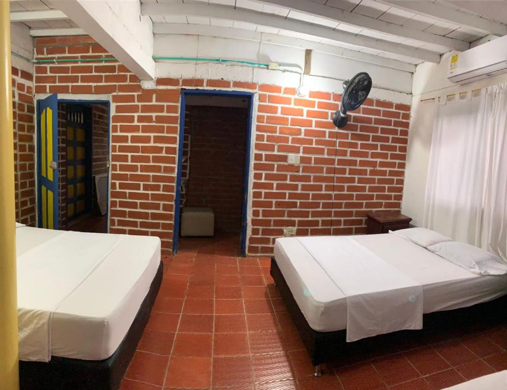 Postel nebo postele na pokoji v ubytování CABAÑA VILLA DEL COCO