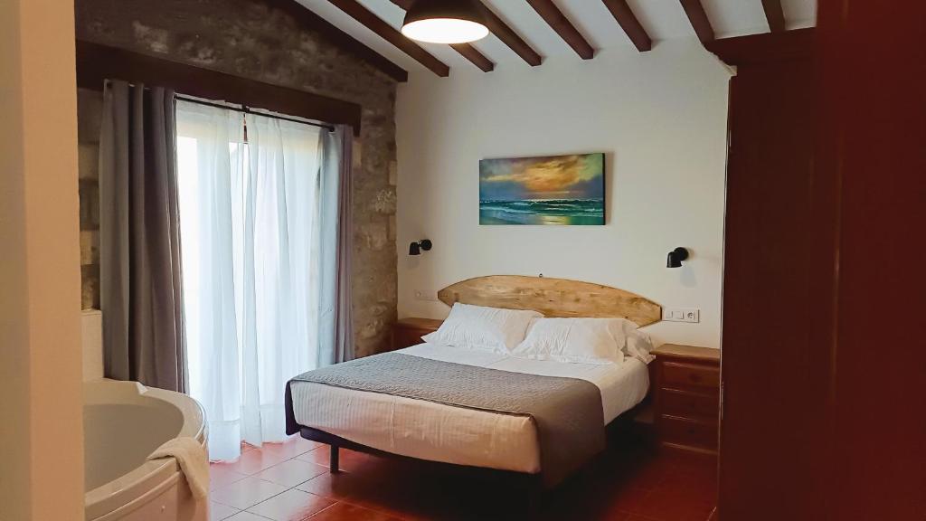 Cama o camas de una habitación en Posada Punta Liñera