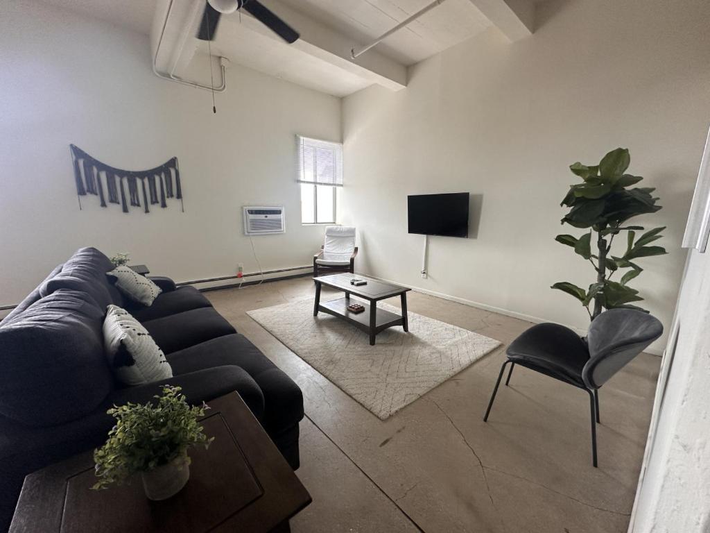 A seating area at Flexhome Westown 1BR RS2 near Fiserv and Theater District - READ INFO