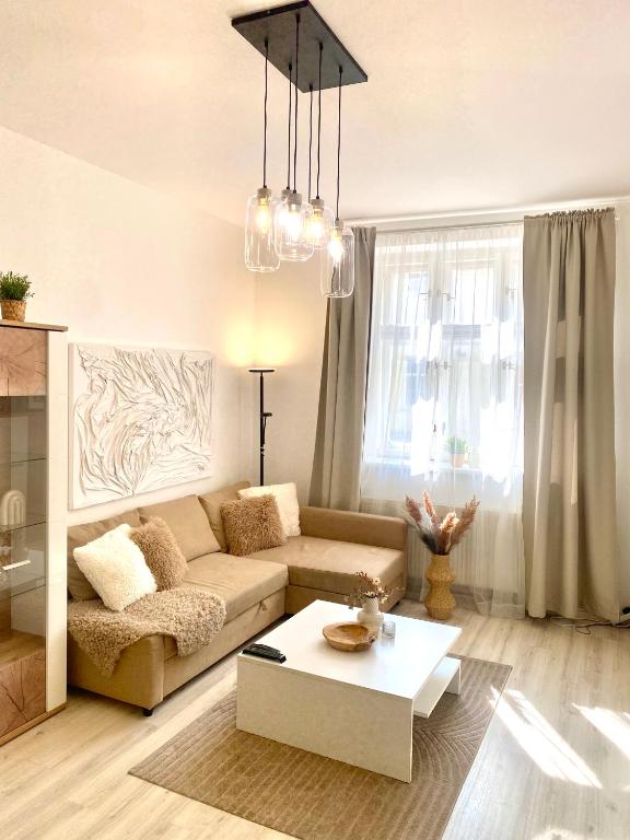 a living room with a couch and a coffee table at JAMES BOND Apartment TOP Location Air Conditioned in Bratislava