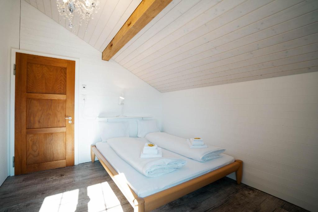 Postel nebo postele na pokoji v ubytování Apartment Sunnerösli