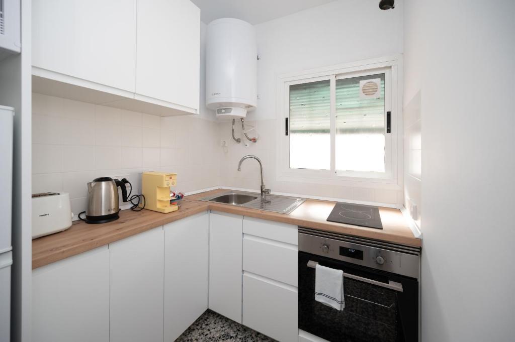 Kuchyň nebo kuchyňský kout v ubytování Tradicional apartamento central de 2 camas dobles