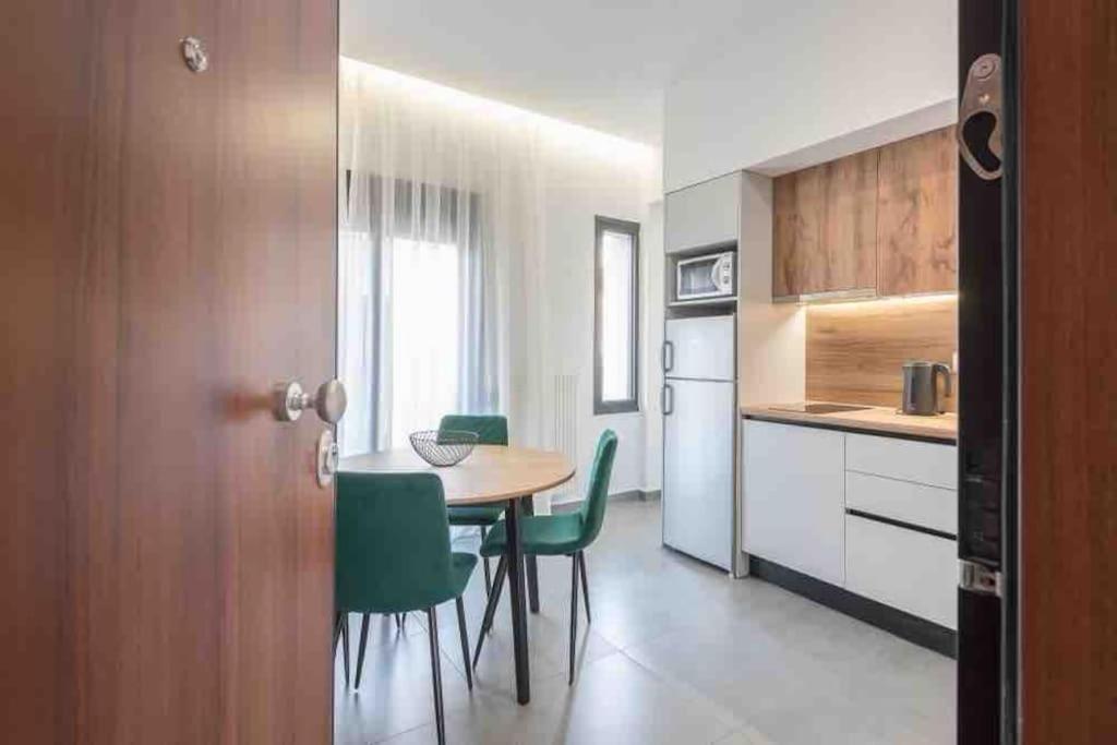 Kuchyň nebo kuchyňský kout v ubytování Cozy apartment in a new building apartment 2