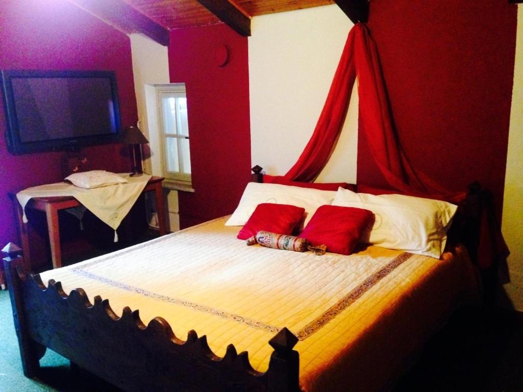 A bed or beds in a room at B&B Il Castello del Ghiro RENT E-BIKE