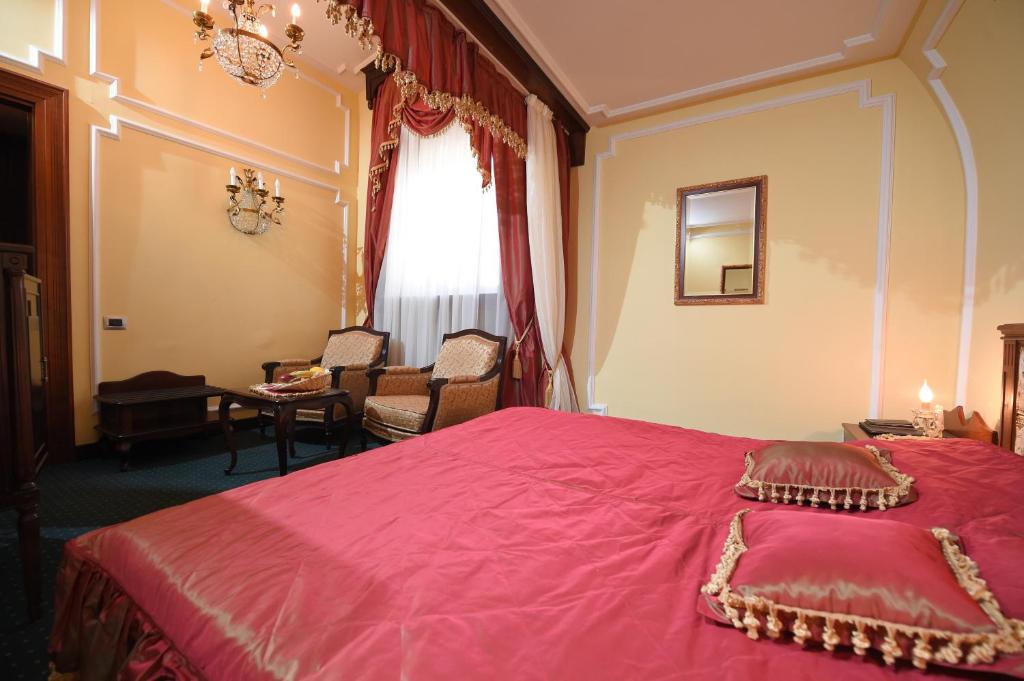 Postel nebo postele na pokoji v ubytování Hotel Leopold I