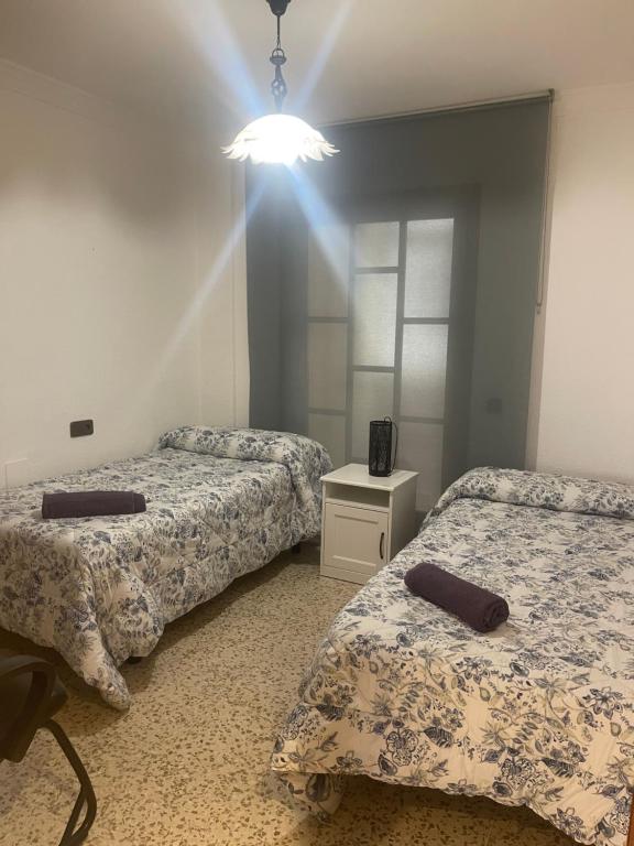 A bed or beds in a room at GRAN Y MAGNÍFICO APARTAMENTO EN MáLAGA