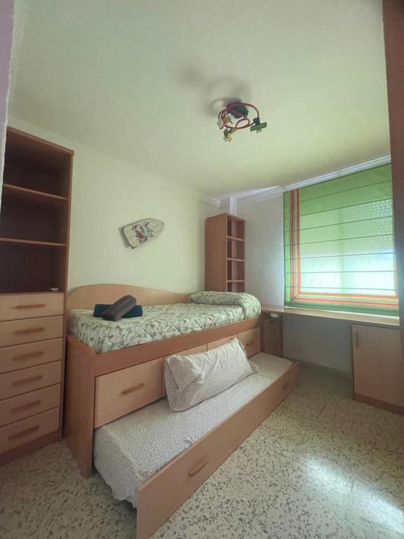 A bed or beds in a room at GRAN Y MAGNÍFICO APARTAMENTO EN MáLAGA