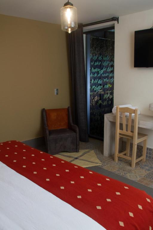 Postel nebo postele na pokoji v ubytování Hotel Helverica