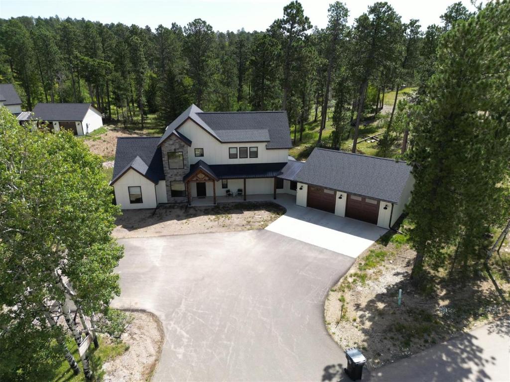an aerial view of a house with a driveway at The Juniper - Hot tub in Lead