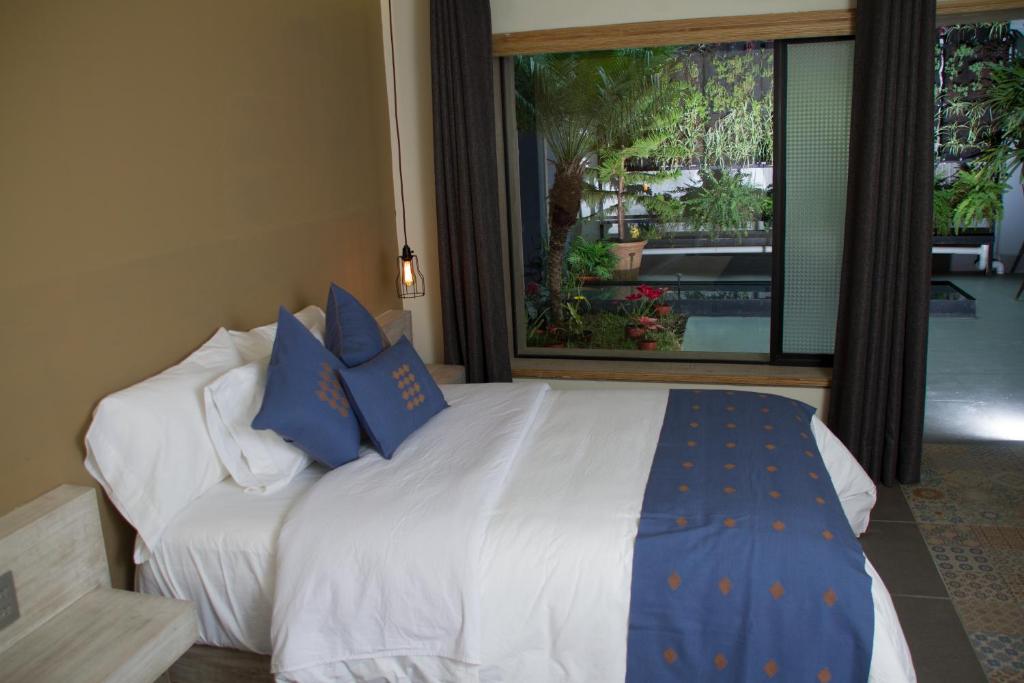 Postel nebo postele na pokoji v ubytování Hotel Helverica