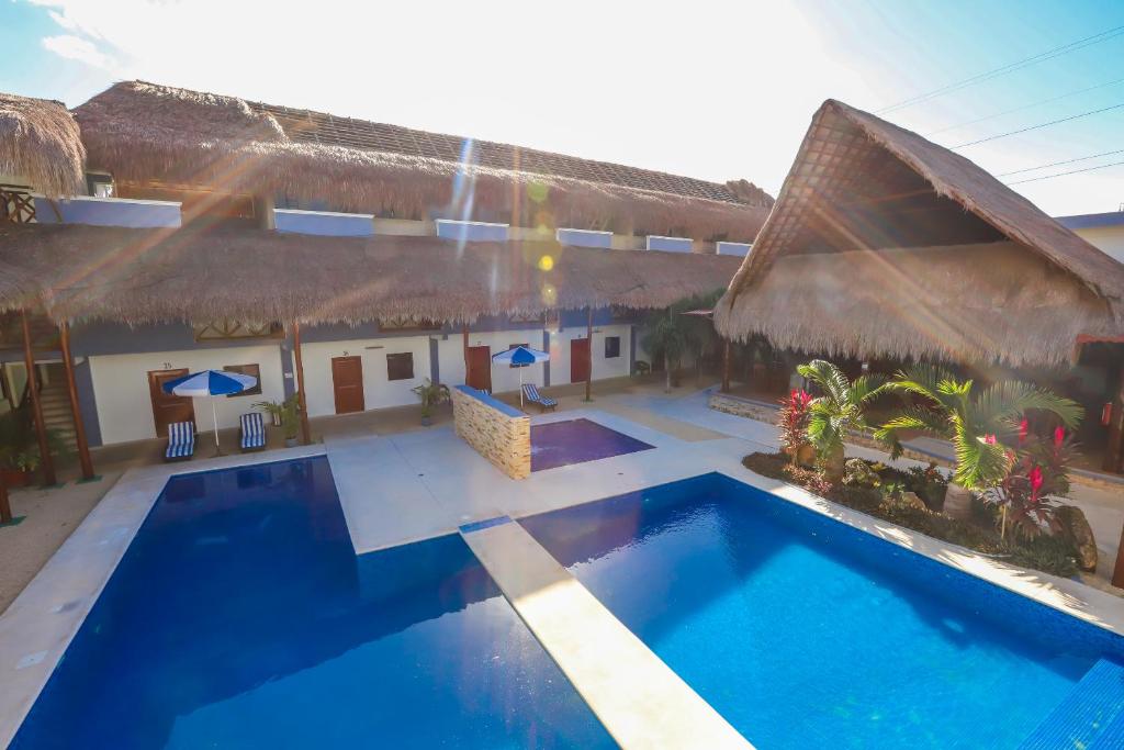 an aerial view of a resort with a swimming pool at Hotel Pejelagarto in Bacalar