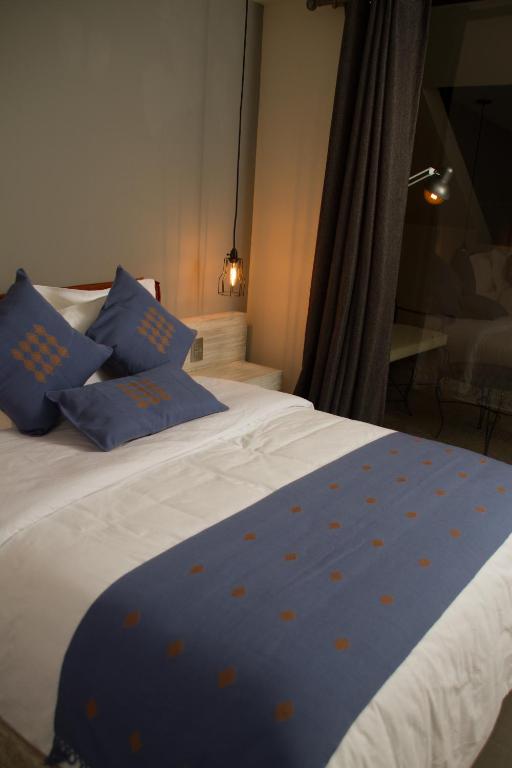 Postel nebo postele na pokoji v ubytování Hotel Helverica