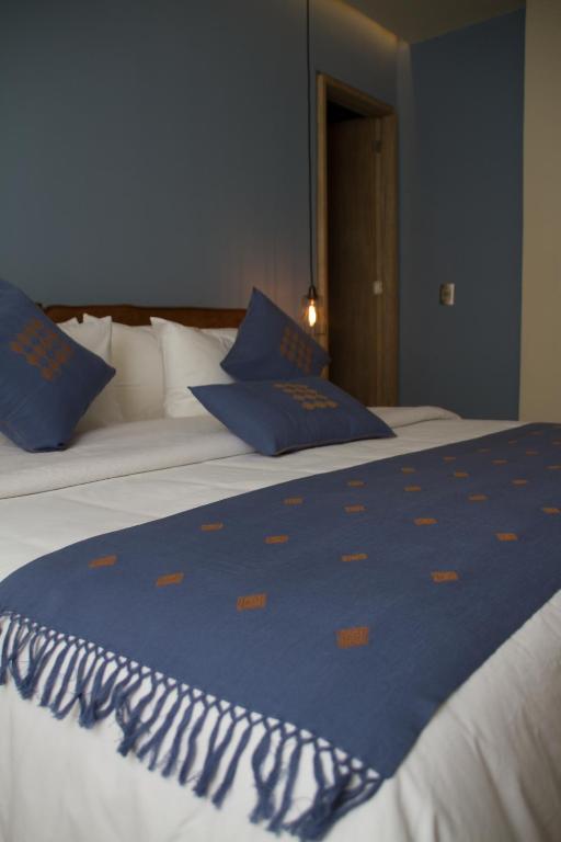 Postel nebo postele na pokoji v ubytování Hotel Helverica