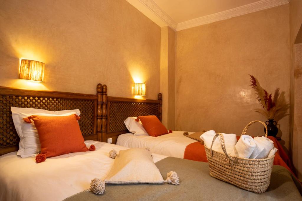 Postel nebo postele na pokoji v ubytování Riad Darino Marrakech Heritage