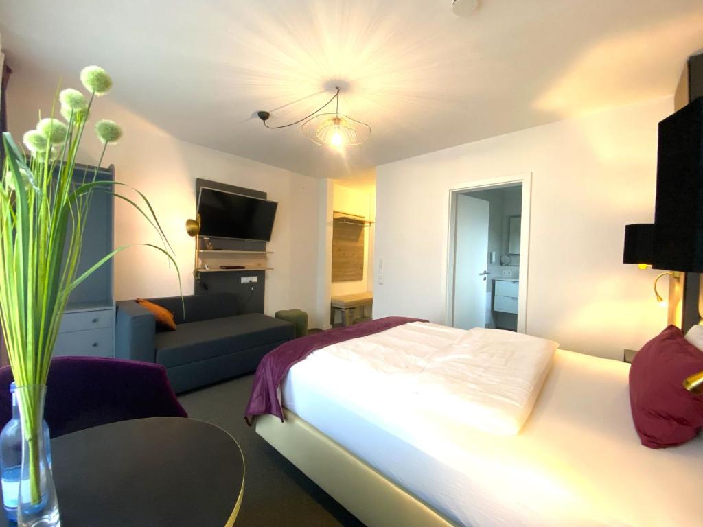 Postel nebo postele na pokoji v ubytování Apartments Amtzell, Selbst-Check-in