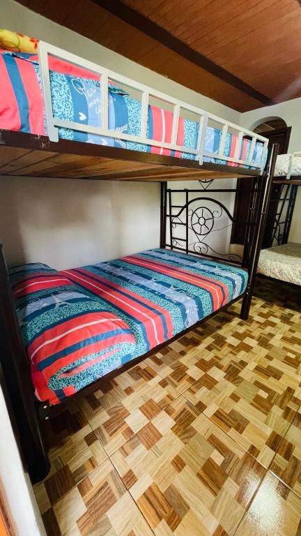 Una cama o camas en una habitación de Guadalupe