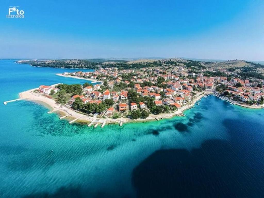 an aerial view of a small island in the water at Apartments Govic in Zaboric