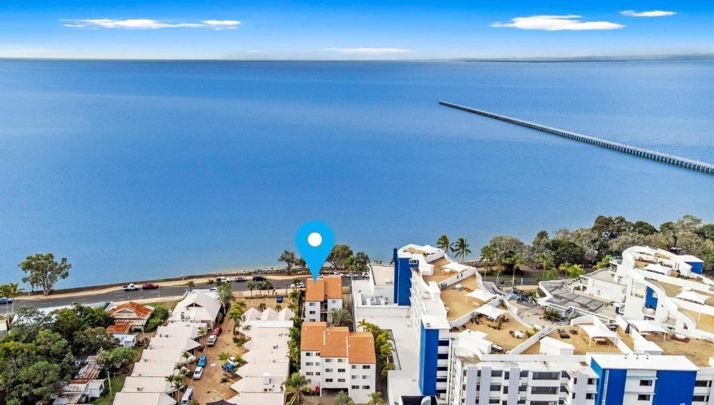 an aerial view of a city and the ocean at Santalina On Hervey Bay in Hervey Bay