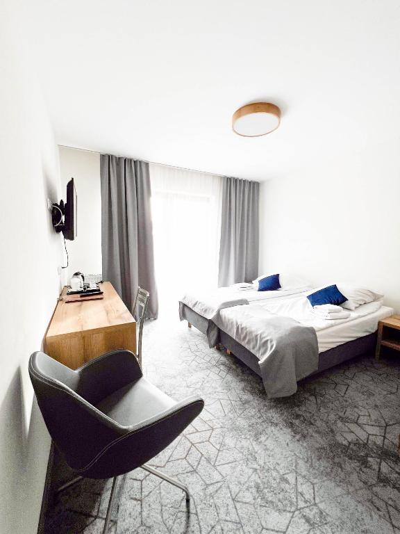 Postel nebo postele na pokoji v ubytování Hotel Beskidian