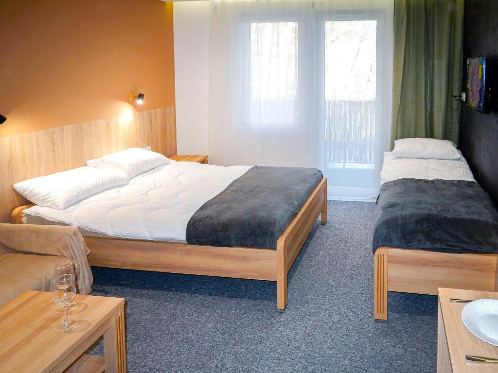 Postel nebo postele na pokoji v ubytování SEA-PORT Resort