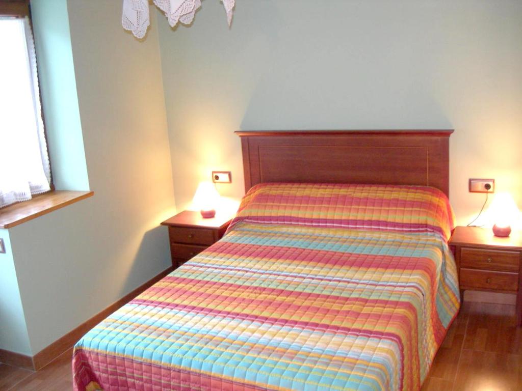 A bed or beds in a room at Charming Chalet in Viella, Mountain View