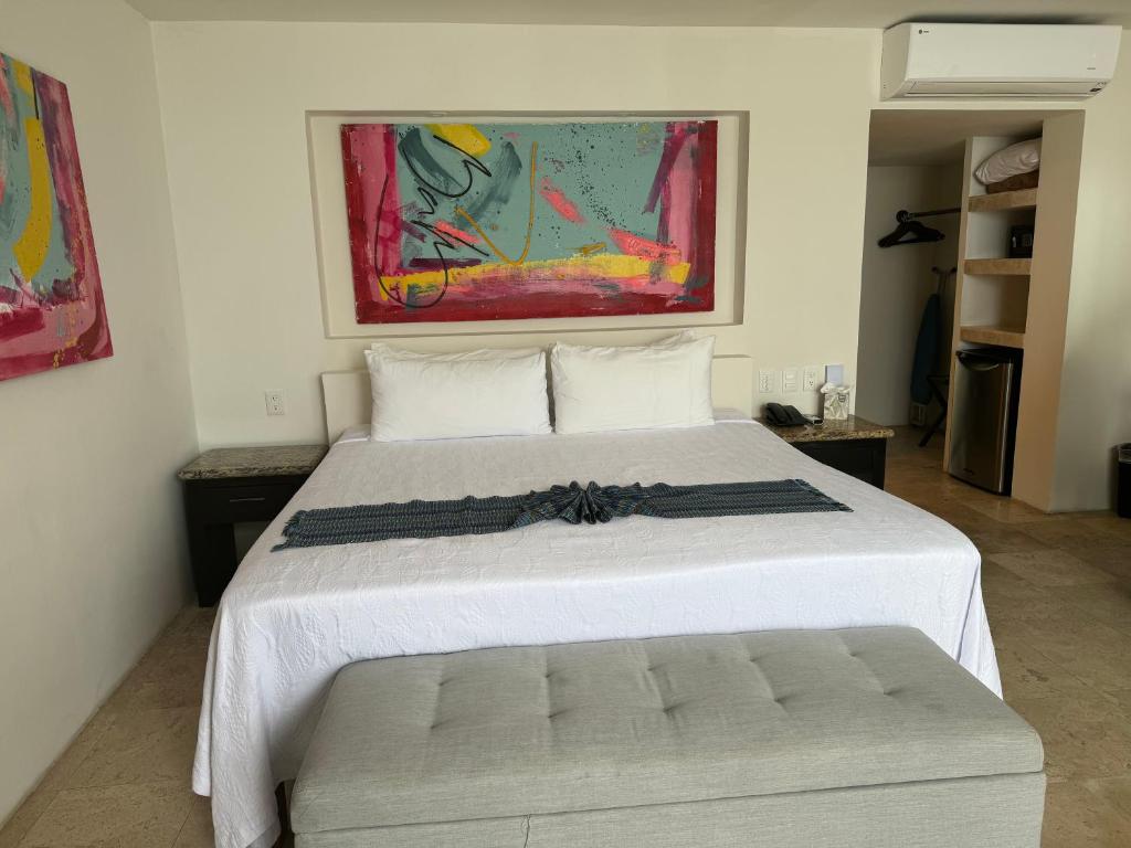 Postel nebo postele na pokoji v ubytování Hotel Delfín Vista Pier Beach Front
