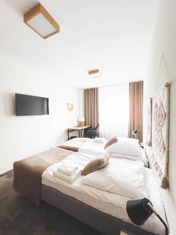 Postel nebo postele na pokoji v ubytování Hotel Beskidian
