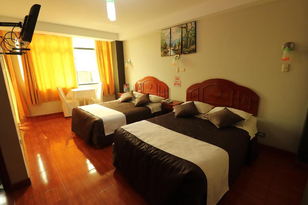 Postel nebo postele na pokoji v ubytování Hotel Frontera