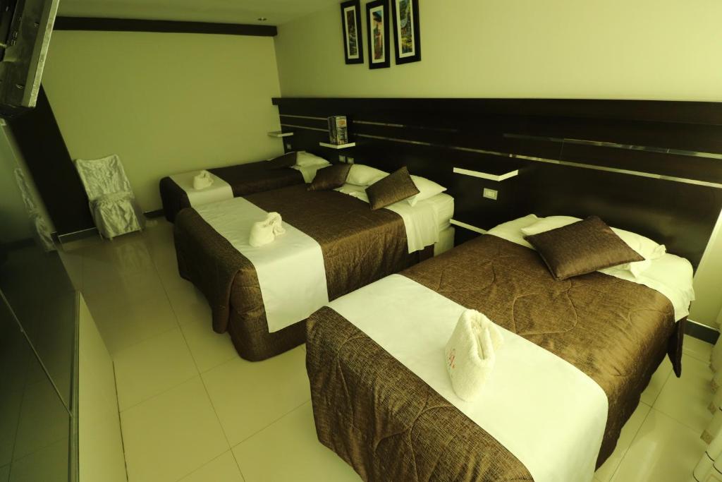 Postel nebo postele na pokoji v ubytování Hotel Frontera
