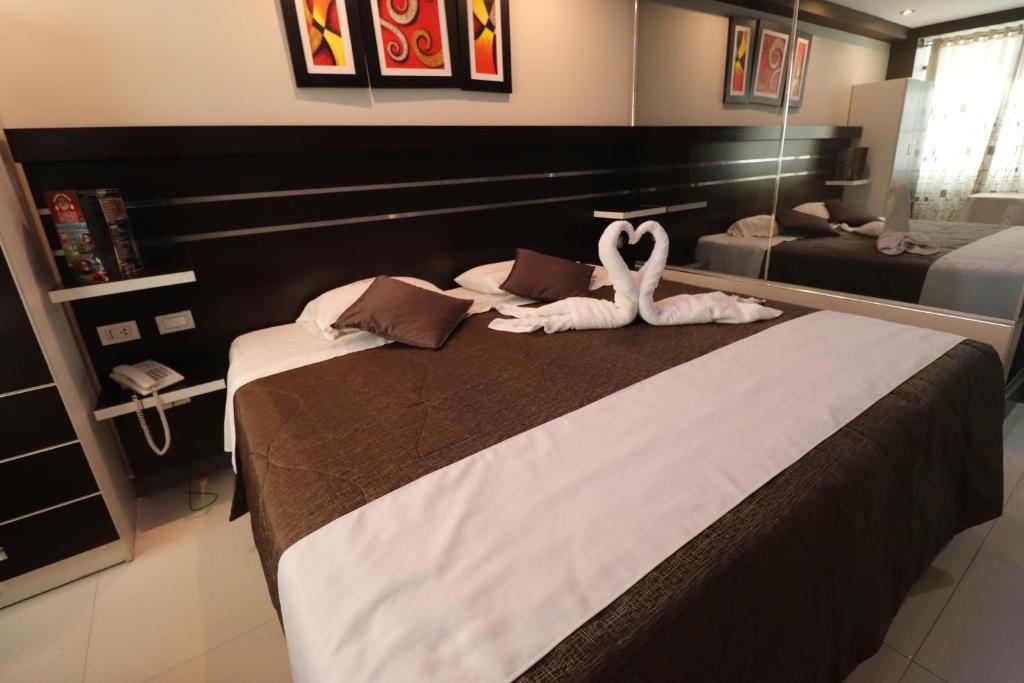 Postel nebo postele na pokoji v ubytování Hotel Frontera