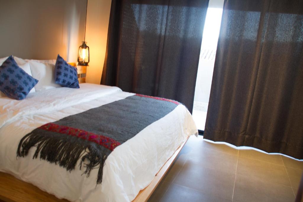 Postel nebo postele na pokoji v ubytování Hotel Helverica