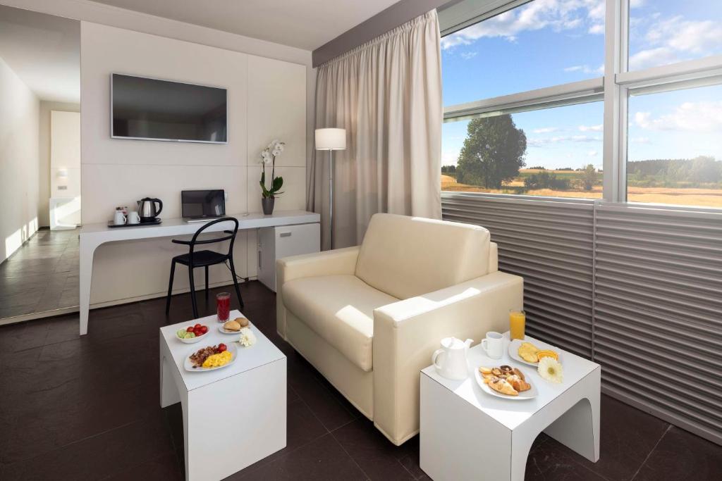 TV a/nebo společenská místnost v ubytování Best Western Hotel Green City