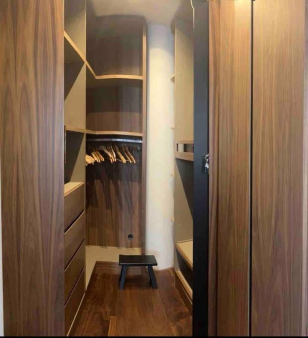 a walk in closet with a stool in it at Appt River view next Eiffel Tour &amp; Roland-Garros in Boulogne-Billancourt
