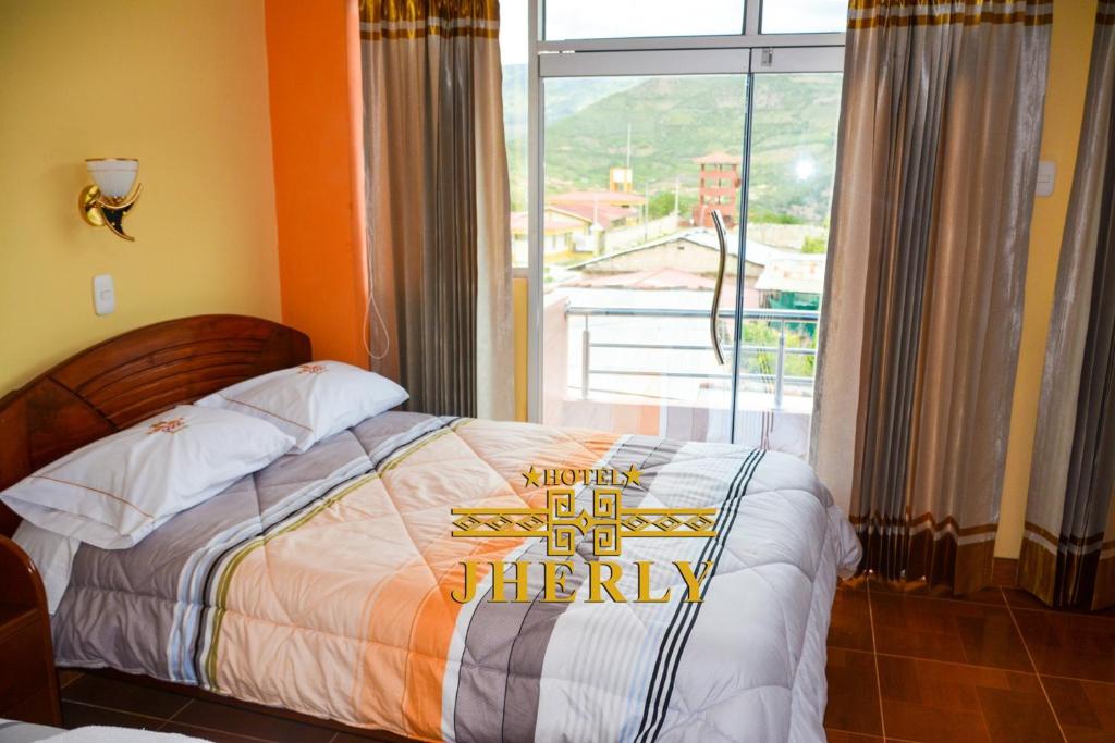 a bedroom with a bed with a happy birthday sign on it at HOTEL JHERLY in Nuevo Tingo