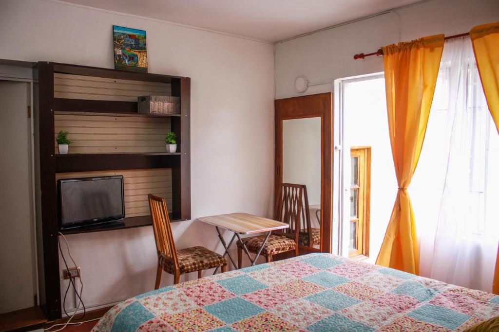 Postel nebo postele na pokoji v ubytování Hostal EntreOrientes