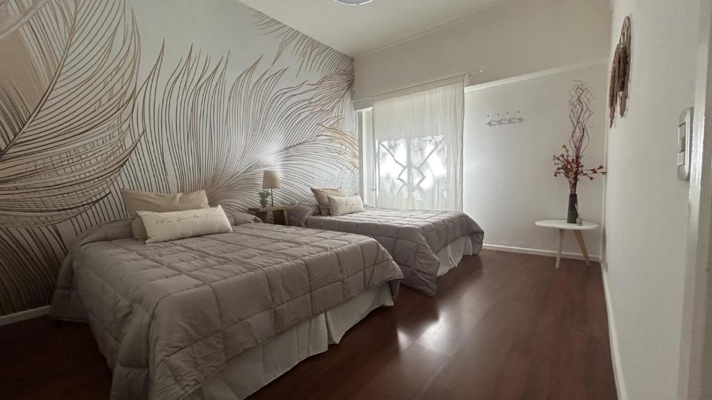 Кровать или кровати в номере Apartamento Flowers