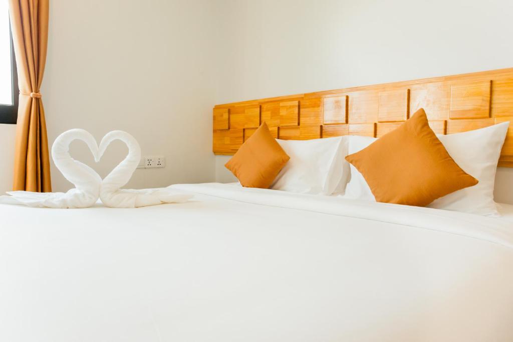 Postel nebo postele na pokoji v ubytování AIMI Beach Hotel
