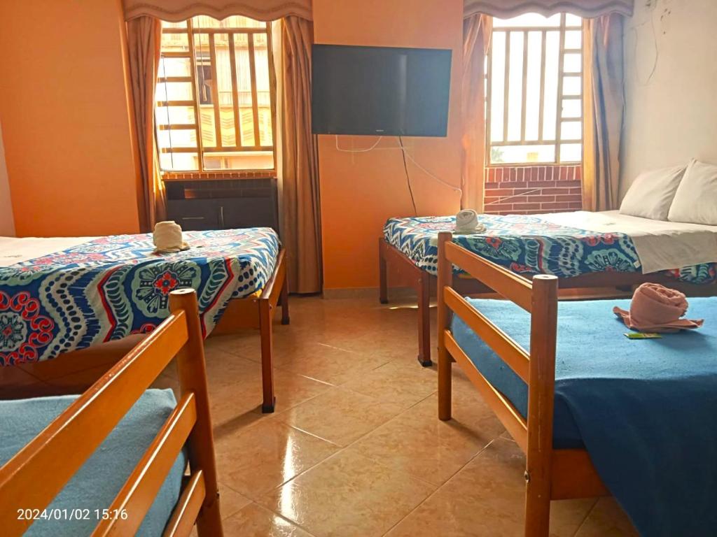 Giường trong phòng chung tại Hotel Dorado Real