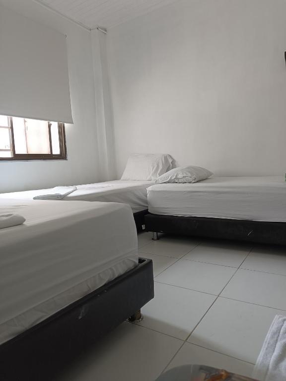 Postel nebo postele na pokoji v ubytování Riviera Central Hotel - Monteria