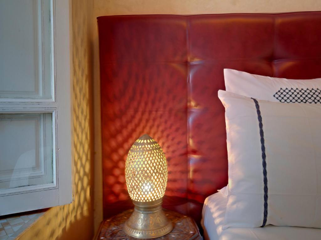 Postel nebo postele na pokoji v ubytování Riad Princesse Du Désert & Spa