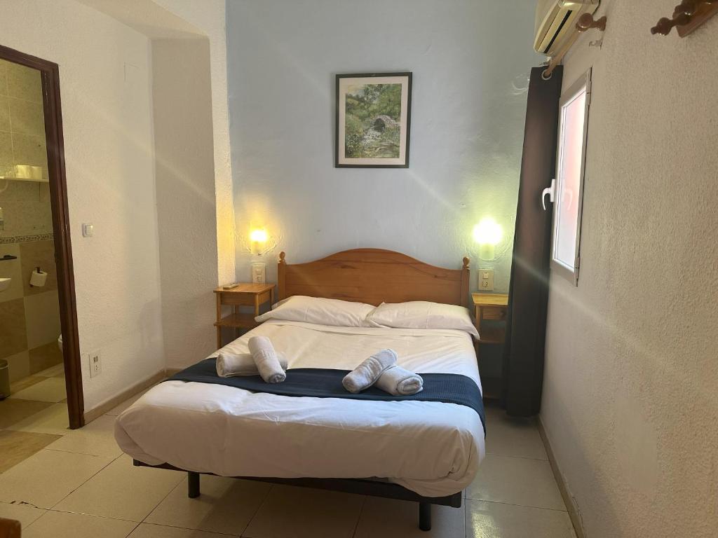 Ένα ή περισσότερα κρεβάτια σε δωμάτιο στο Barraca Suites