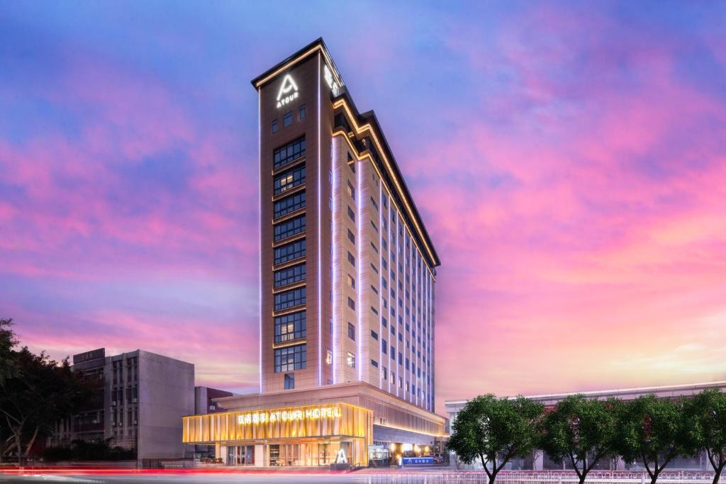 a rendering of a tall building with a clock tower at Atour Hotel Meizhou Meixian Baili Plaza in Meizhou