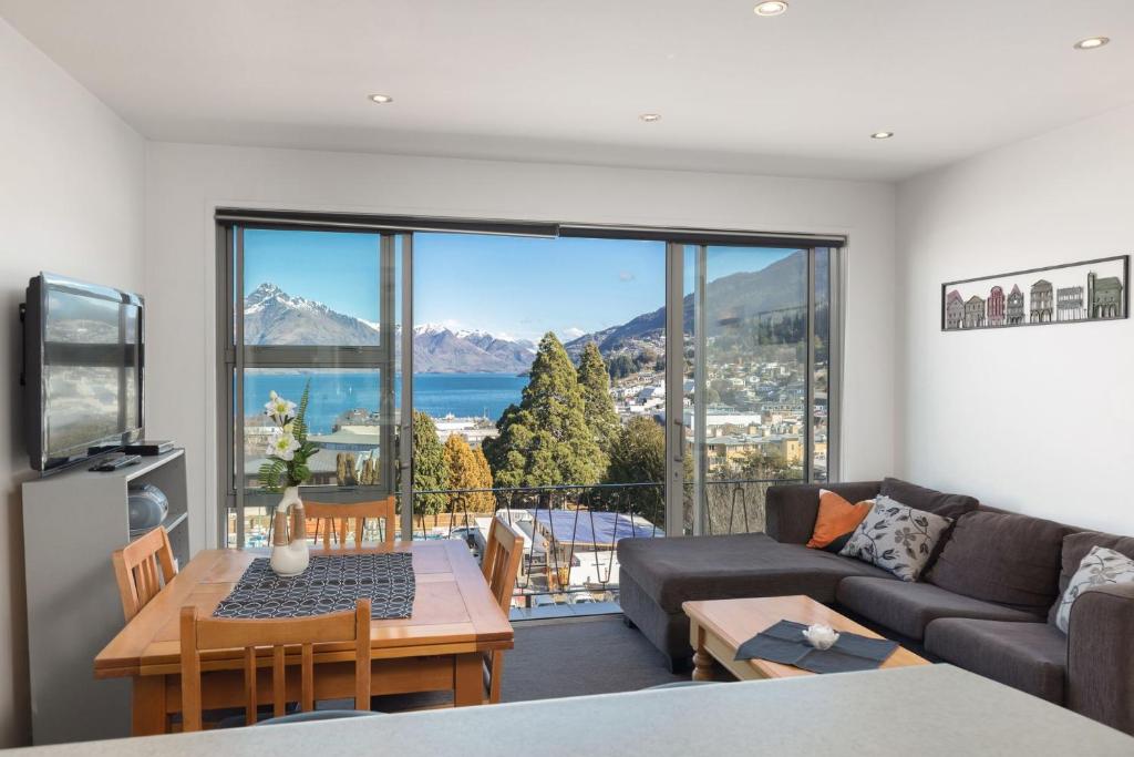 a living room with a couch and a table at Ballarat Bungalow in Queenstown