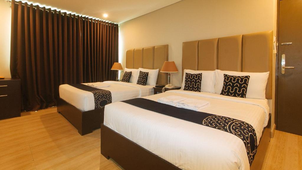 Postel nebo postele na pokoji v ubytování Asrodel Hotel RedPartner