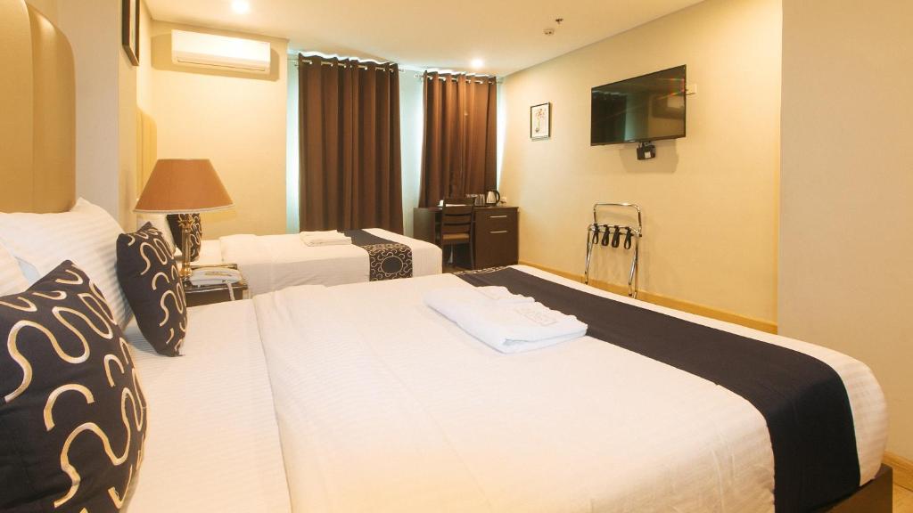 Postel nebo postele na pokoji v ubytování Asrodel Hotel RedPartner