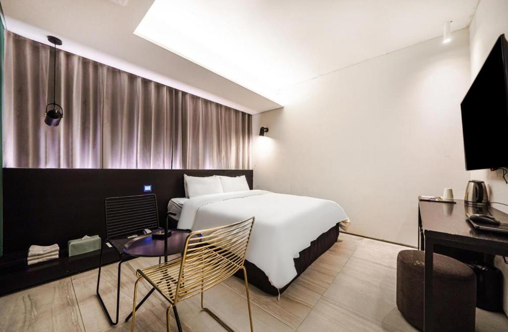 TV a/nebo společenská místnost v ubytování H Hotel Wangsimni