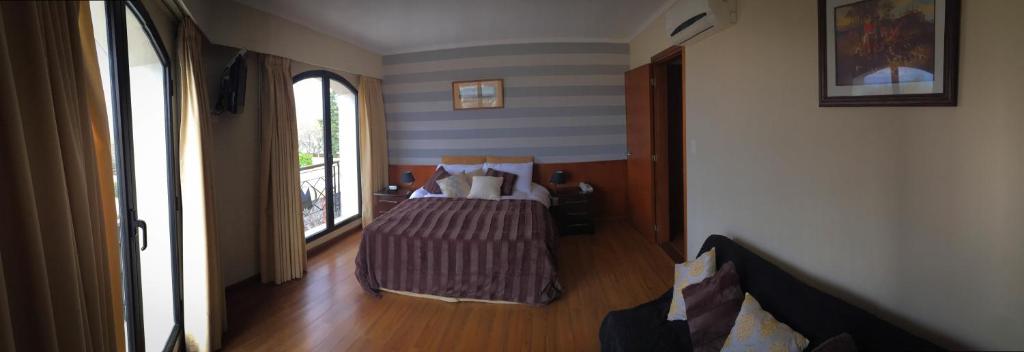 Postel nebo postele na pokoji v ubytování Hotel MAXIM